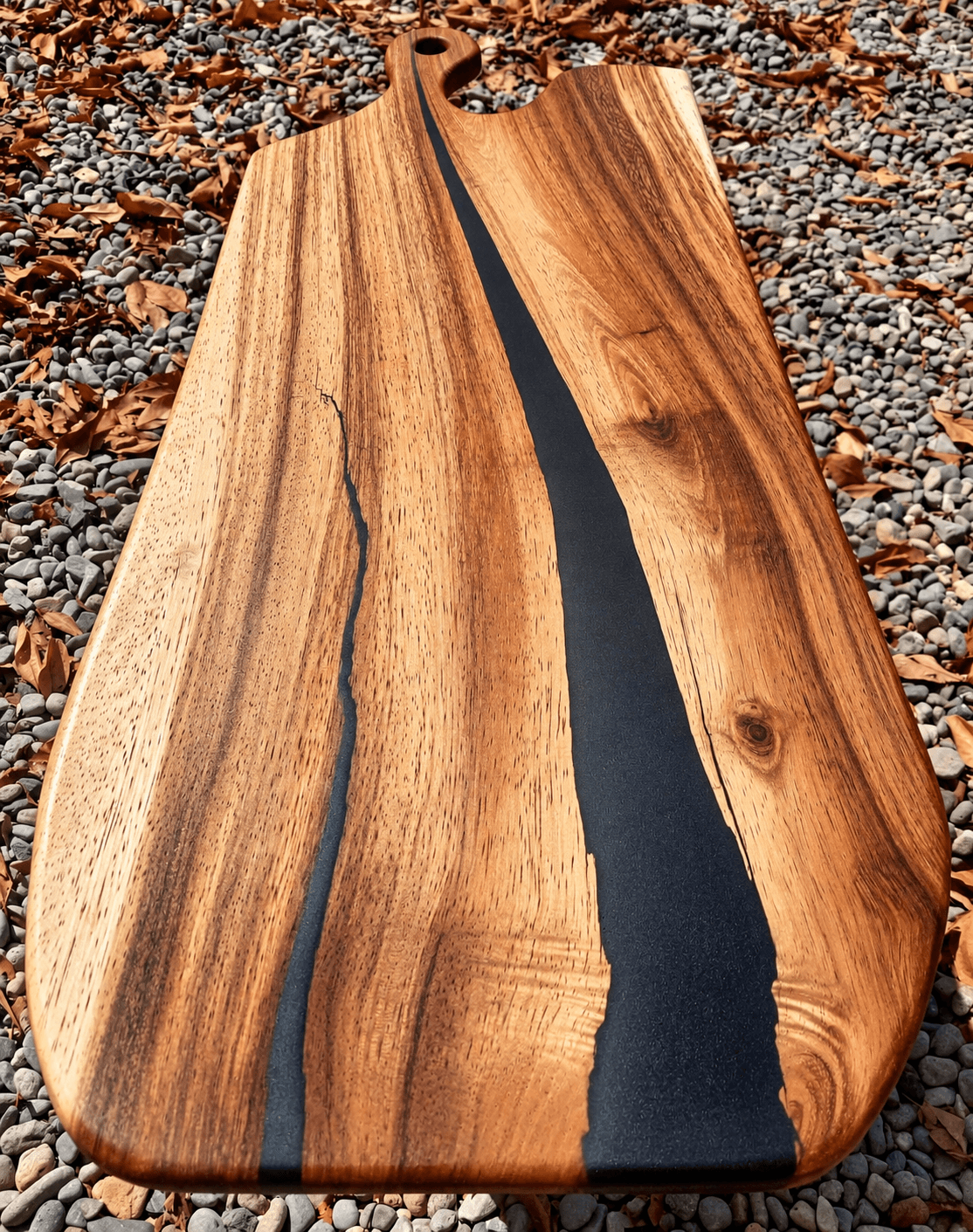 Live-edge wood charcuterie board with natural bark edge